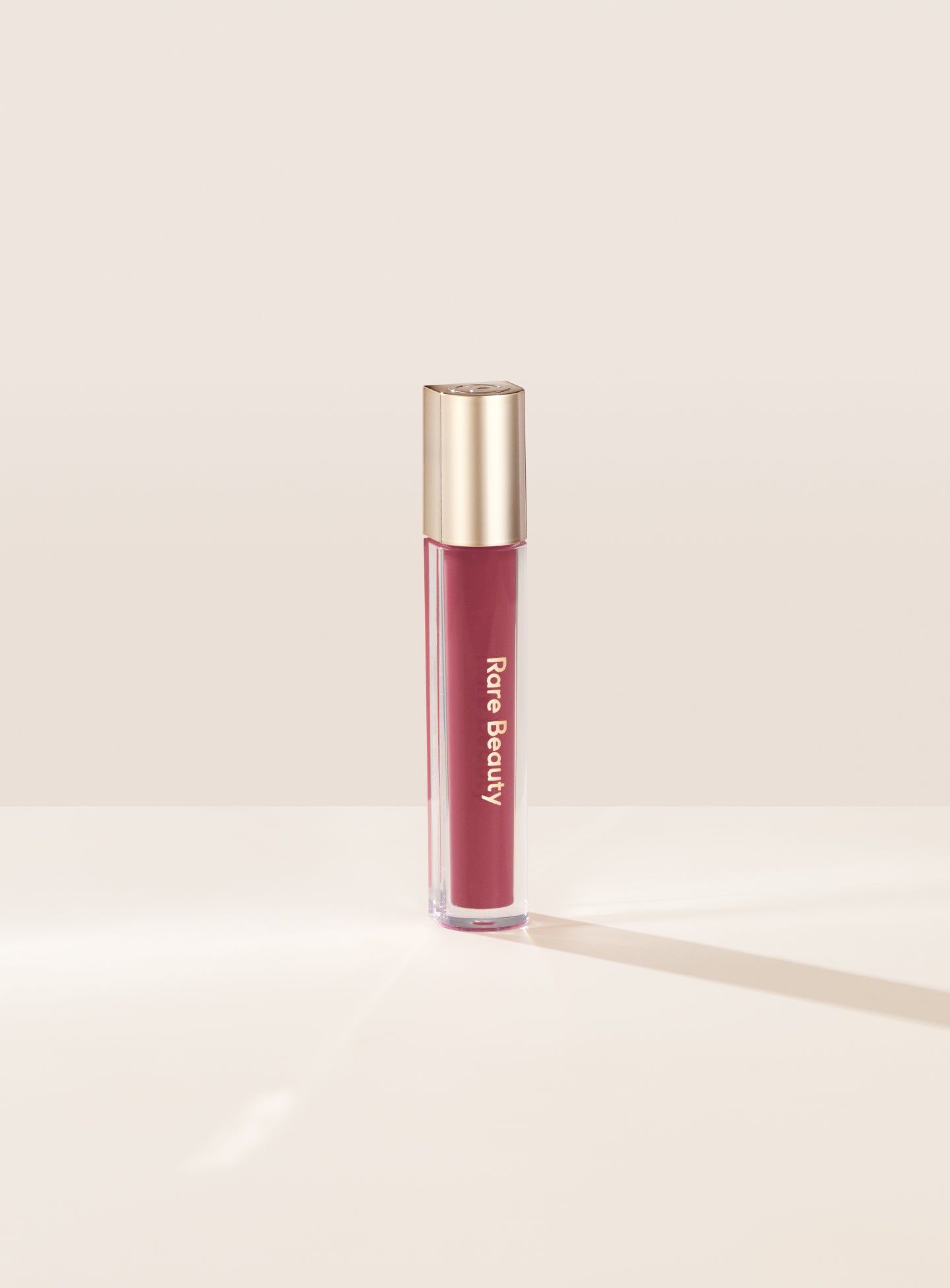 Stay Vulnerable Glossy Lip Balm / Nearly Mauve - Rare Beauty.