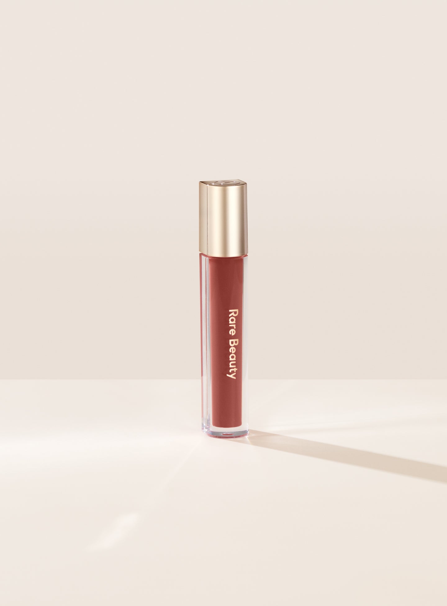 Stay Vulnerable Glossy Lip Balm / Nearly Neutral  - Rare Beauty.